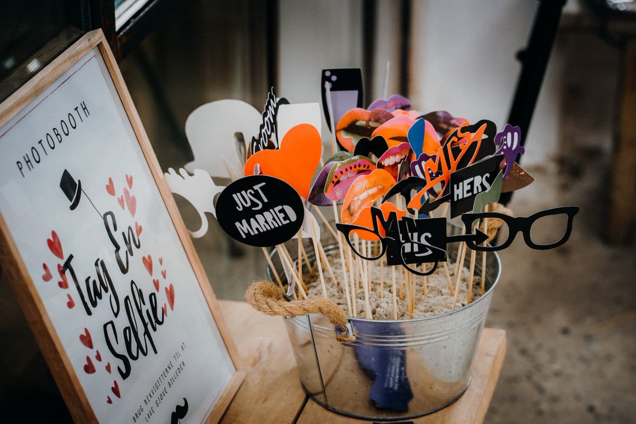 Photo booth sign and props ready for guests